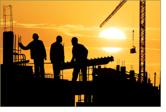 "Image depicts construction workers on a large building site"